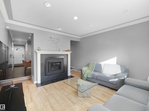 3611 30 Avenue, Edmonton, AB - Indoor Photo Showing Living Room With Fireplace