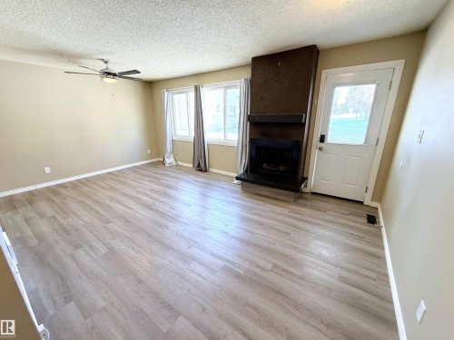 4339 46 Street, Stony Plain, AB - Indoor Photo Showing Living Room With Fireplace