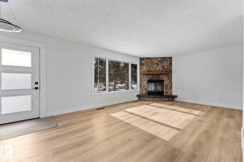 11744 37 Avenue, Edmonton, AB - Indoor Photo Showing Living Room With Fireplace