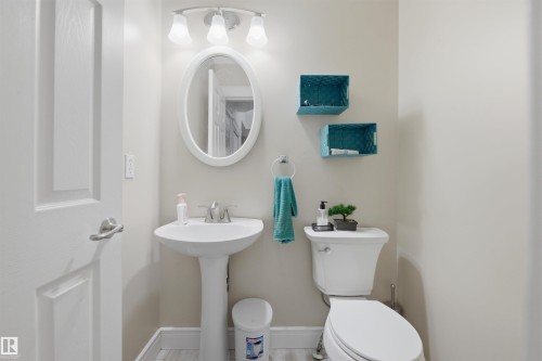 Half bathroom featuring toilet and baseboards - 444 Breckenridge Lane Nw, Edmonton, AB - Indoor Photo Showing Bathroom