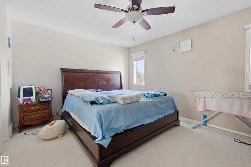 Bedroom with light colored carpet and ceiling fan - 444 Breckenridge Lane Nw, Edmonton, AB - Indoor Photo Showing Bedroom