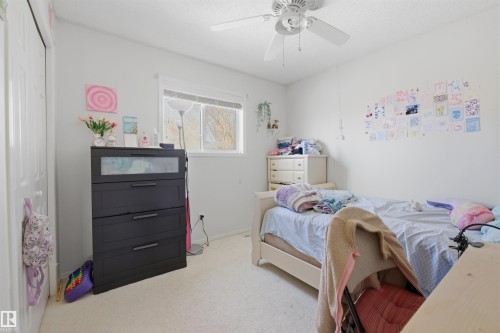 Bedroom featuring light colored carpet, ceiling fan, and a closet - 444 Breckenridge Lane Nw, Edmonton, AB - Indoor Photo Showing Bedroom