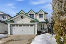 View of front facade with an attached garage, concrete driveway, and a porch - 444 Breckenridge Lane Nw, Edmonton, AB  - Outdoor With Facade 
