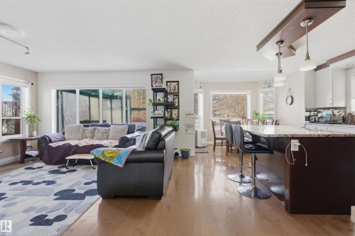 Living room with light wood finished floors and a textured ceiling - 444 Breckenridge Lane Nw, Edmonton, AB - Indoor Photo Showing Living Room