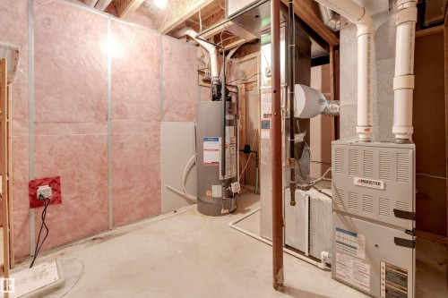 Utility room featuring gas water heater - 1157 37 Avenue, Edmonton, AB - Indoor Photo Showing Basement