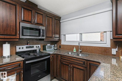 13016 79 Street, Edmonton, AB - Indoor Photo Showing Kitchen With Double Sink