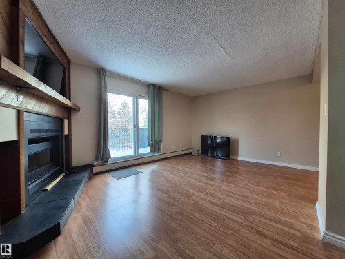 6 9140 149 Street, Edmonton, AB - Indoor Photo Showing Other Room With Fireplace