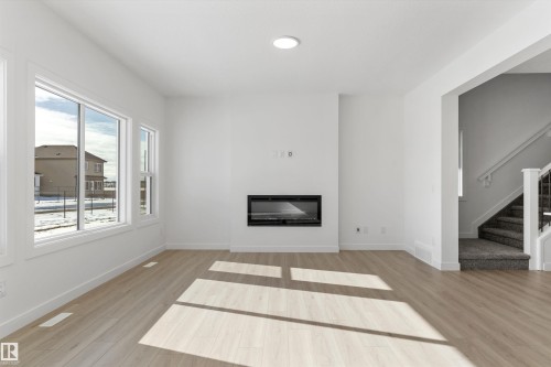 939 18 Avenue, Edmonton, AB - Indoor Photo Showing Living Room With Fireplace