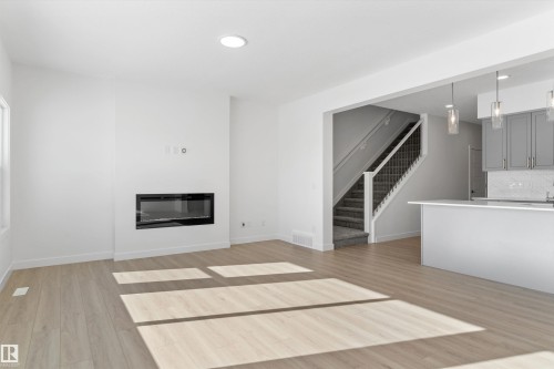 939 18 Avenue, Edmonton, AB - Indoor Photo Showing Living Room With Fireplace
