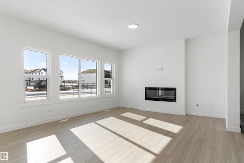 939 18 Avenue, Edmonton, AB - Indoor Photo Showing Living Room With Fireplace