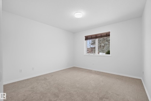 Carpeted spare room with baseboards - 19 Country Lane, Stony Plain, AB - Indoor Photo Showing Other Room