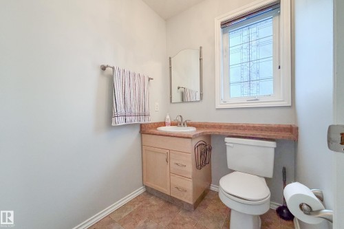 Bathroom with vanity and light tile patterned floors - 19 Country Lane, Stony Plain, AB - Indoor Photo Showing Bathroom