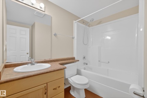 Bathroom featuring vanity and washtub / shower combination - 19 Country Lane, Stony Plain, AB - Indoor Photo Showing Bathroom