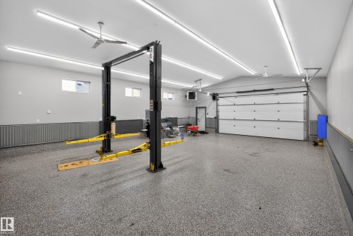 Garage featuring a wainscoted wall - 19 Country Lane, Stony Plain, AB - Indoor Photo Showing Garage