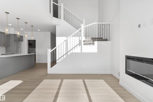 943 18 Avenue, Edmonton, AB - Indoor Photo Showing Other Room With Fireplace