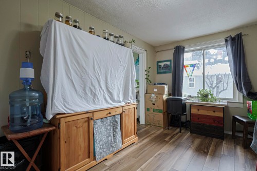 Office with a textured ceiling and light wood-type flooring - 4906 48 Street, Thorsby, AB - Indoor