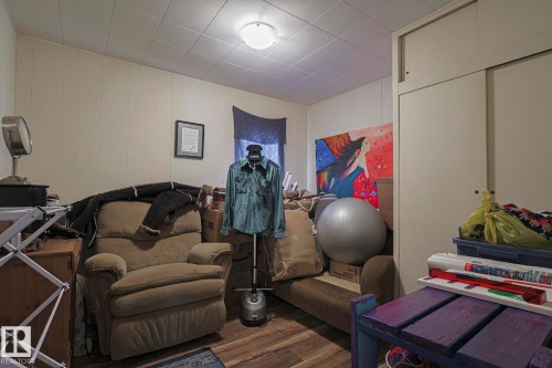 Exercise room featuring wood finished floors - 4906 48 Street, Thorsby, AB - Indoor