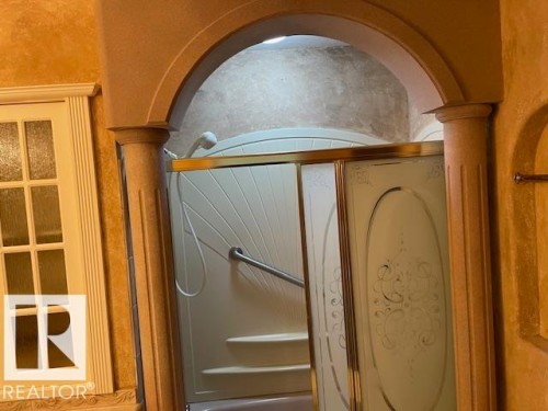 Detailed view of ornate columns and arched walkways - 11 Campbell, Stony Plain, AB - Indoor Photo Showing Other Room