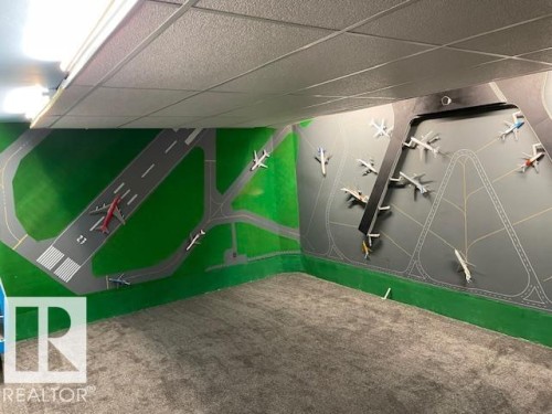 Detailed view of carpet flooring and a drop ceiling - 11 Campbell, Stony Plain, AB - 