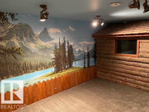 Bonus room featuring carpet floors and a mountain view - 11 Campbell, Stony Plain, AB -  Photo Showing Other Room