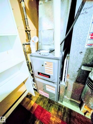 Utilities with heating unit - 80 Amberly Crest, Edmonton, AB - Indoor Photo Showing Basement