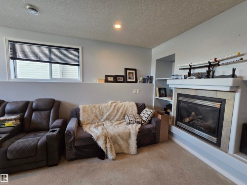 1445 Highwood Boulevard, Devon, AB - Indoor Photo Showing Living Room With Fireplace