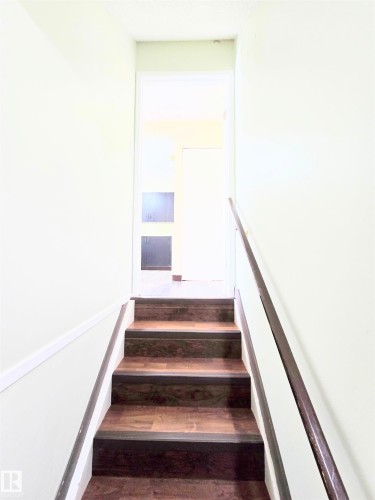 Stairs featuring wood finished floors - 2 4403 Riverbend Road, Edmonton, AB - Indoor Photo Showing Other Room