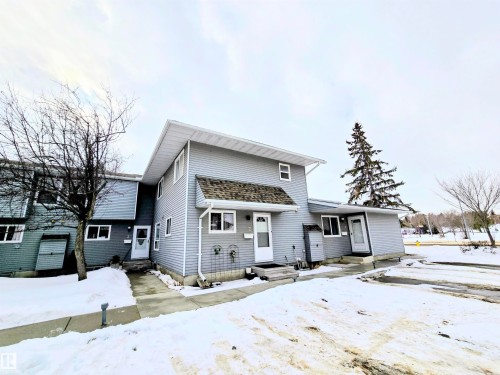 View of front of house with entry steps - 2 4403 Riverbend Road, Edmonton, AB - Outdoor With Facade