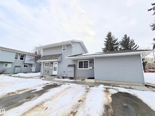 Traditional-style house featuring entry steps - 2 4403 Riverbend Road, Edmonton, AB - Outdoor