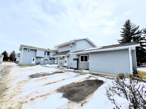 View of snow covered rear of property - 2 4403 Riverbend Road, Edmonton, AB - Outdoor