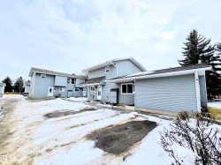 View of snow covered rear of property - 