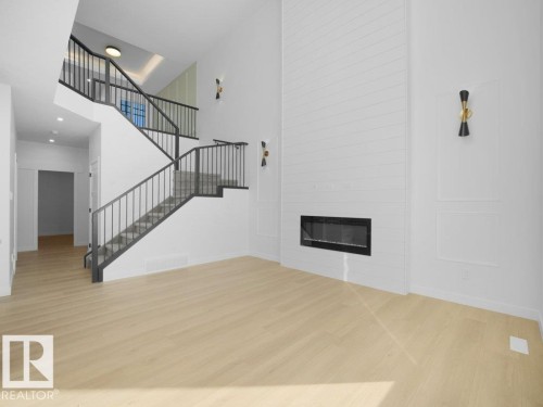 810 Elderberry Crest, Edmonton, AB - Indoor Photo Showing Other Room With Fireplace