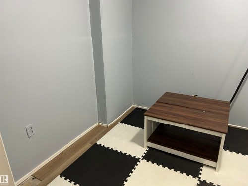 Detailed view of wood finished floors and baseboards - 17 9520 174 Street, Edmonton, AB - Indoor Photo Showing Other Room