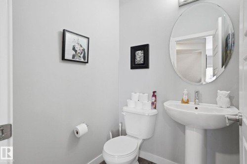 Bathroom featuring toilet and baseboards - 90 1010 Rabbit Hill Road, Edmonton, AB - Indoor Photo Showing Bathroom