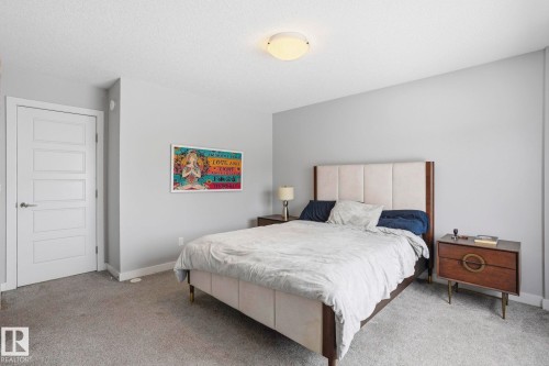 Bedroom featuring carpet flooring and a textured ceiling - 90 1010 Rabbit Hill Road, Edmonton, AB - Indoor Photo Showing Bedroom