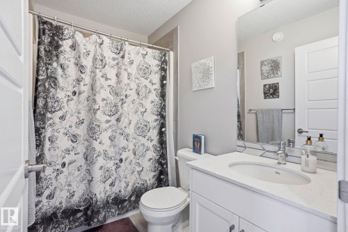 Full bath with vanity and a textured ceiling - 90 1010 Rabbit Hill Road, Edmonton, AB - Indoor Photo Showing Bathroom