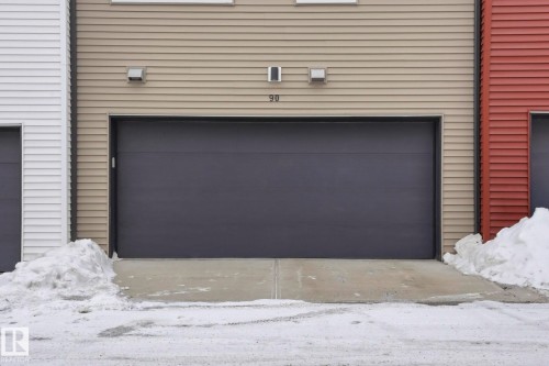 View of snow covered garage - 90 1010 Rabbit Hill Road, Edmonton, AB - Outdoor With Exterior