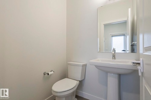 Bathroom with toilet and baseboards - 3520 Kulay Link Link, Edmonton, AB - Indoor Photo Showing Bathroom