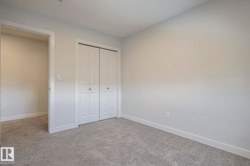Unfurnished bedroom with carpet flooring and a closet - 3520 Kulay Link Link, Edmonton, AB - Indoor Photo Showing Other Room