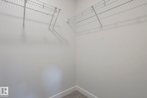 Walk in closet with carpet floors - 3520 Kulay Link Link, Edmonton, AB - Indoor With Storage