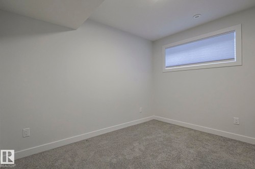 Unfurnished room featuring baseboards and carpet - 3520 Kulay Link Link, Edmonton, AB - Indoor Photo Showing Other Room