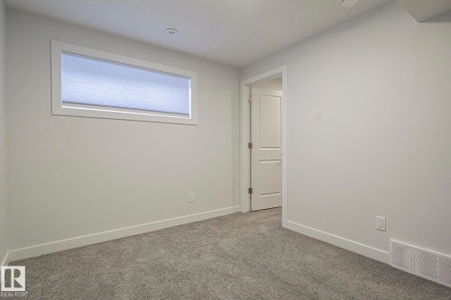 Empty room with carpet flooring and baseboards - 3520 Kulay Link Link, Edmonton, AB - Indoor Photo Showing Other Room