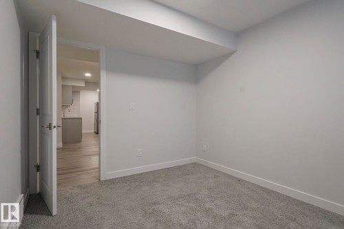 Spare room with baseboards and light carpet - 3520 Kulay Link Link, Edmonton, AB - Indoor Photo Showing Other Room