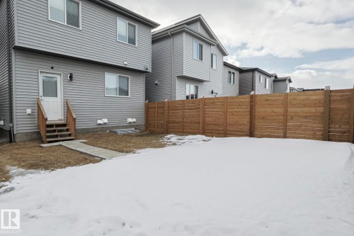 Snow covered rear of property with entry steps - 3520 Kulay Link Link, Edmonton, AB - Outdoor