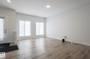 Unfurnished living room featuring light wood-style flooring and baseboards - 3520 Kulay Link Link, Edmonton, AB  - Indoor Photo Showing Other Room 