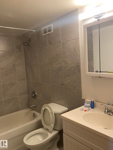 Full bath with vanity and shower / bathtub combination - 205 10345 123 Street, Edmonton, AB - Indoor Photo Showing Bathroom