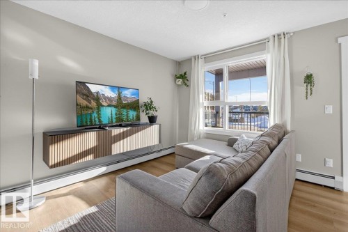 125 1506 Tamarack Boulevard, Edmonton, AB - Indoor Photo Showing Living Room