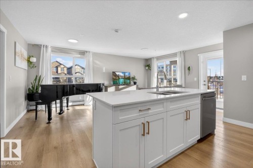 125 1506 Tamarack Boulevard, Edmonton, AB - Indoor Photo Showing Kitchen With Double Sink