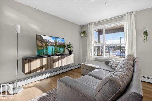 125 1506 Tamarack Boulevard, Edmonton, AB - Indoor Photo Showing Living Room