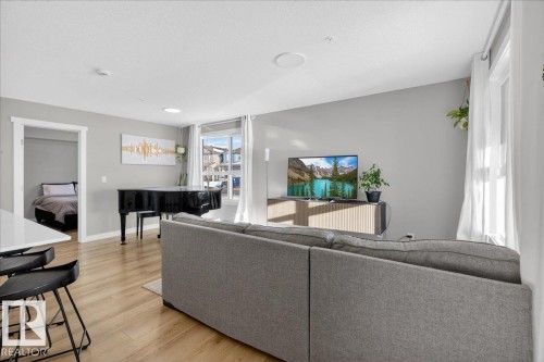 125 1506 Tamarack Boulevard, Edmonton, AB - Indoor Photo Showing Living Room